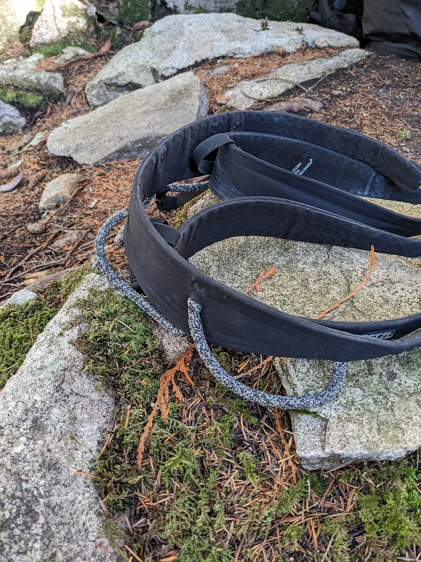 The Petzl Hirundos has one set of stiffer gear loops in the front, and a softer set of loops in the back